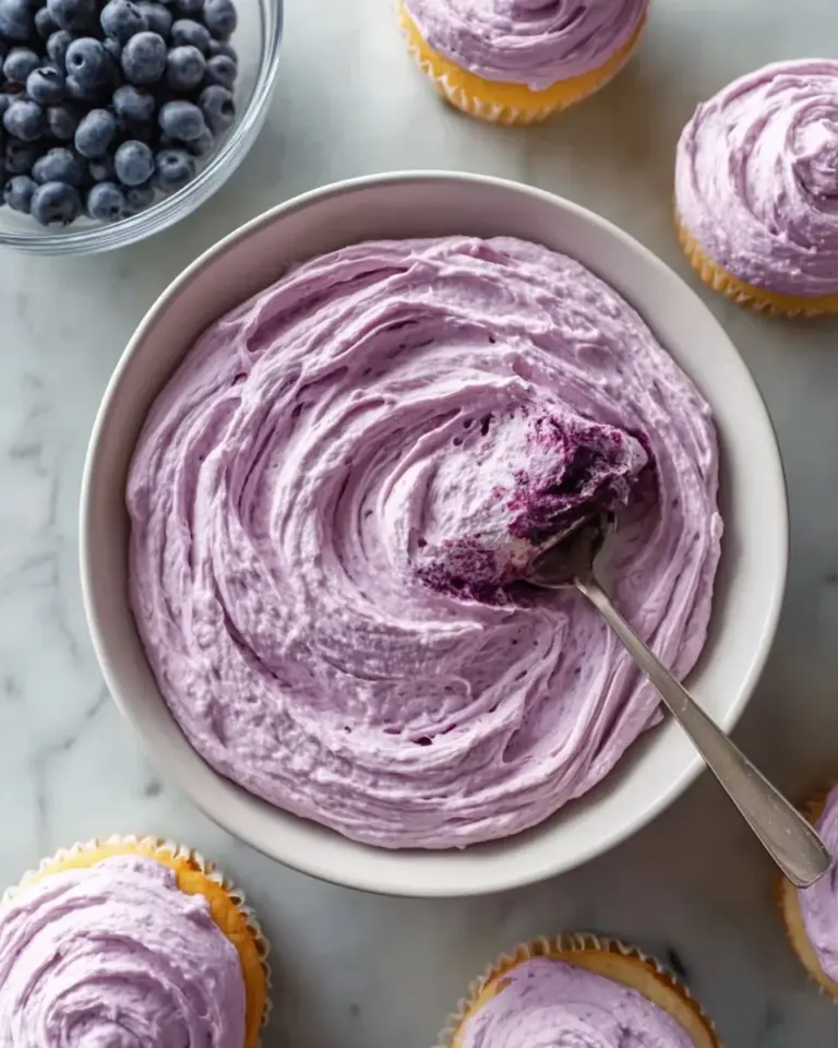 Delicious blueberry cream cheese frosting on a decadent cake