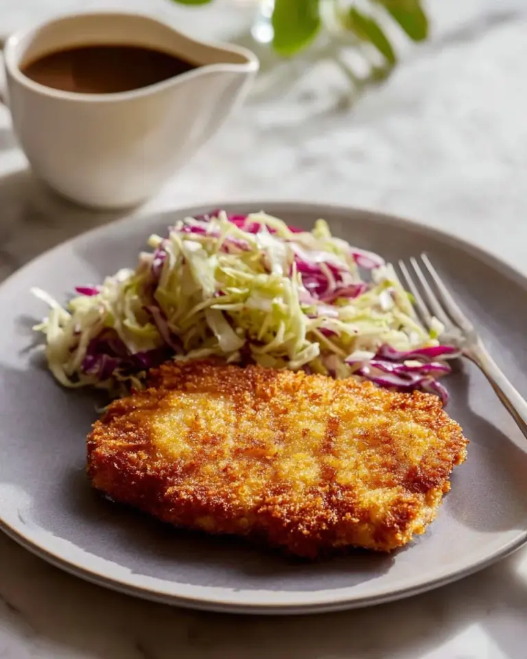 Breaded Parmesan Pork Chops served with a side of vegetables