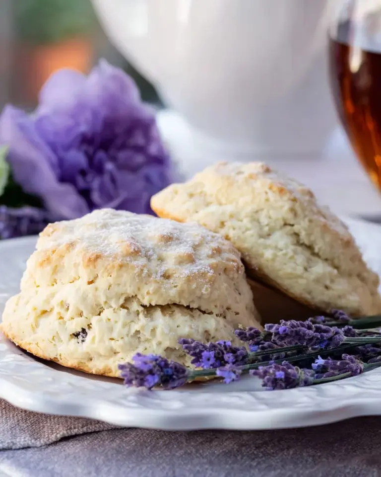 Freshly baked Lavender Scones on a plate garnished with lavender flowers
