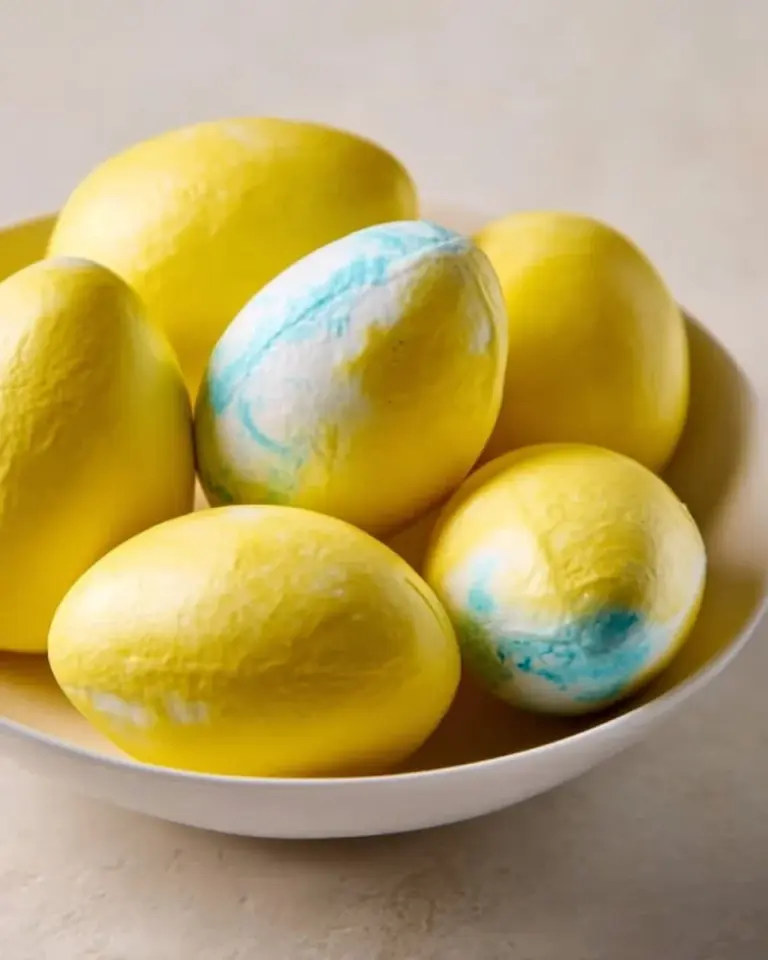 Delicious marshmallow Easter eggs on a colorful background