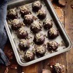 Delicious homemade Bourbon Balls coated in chocolate and nuts