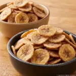 Homemade cinnamon sugar air fryer banana chips in a bowl.