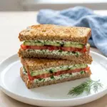 Refreshing cucumber tomato sandwich with fresh vegetables and herbs